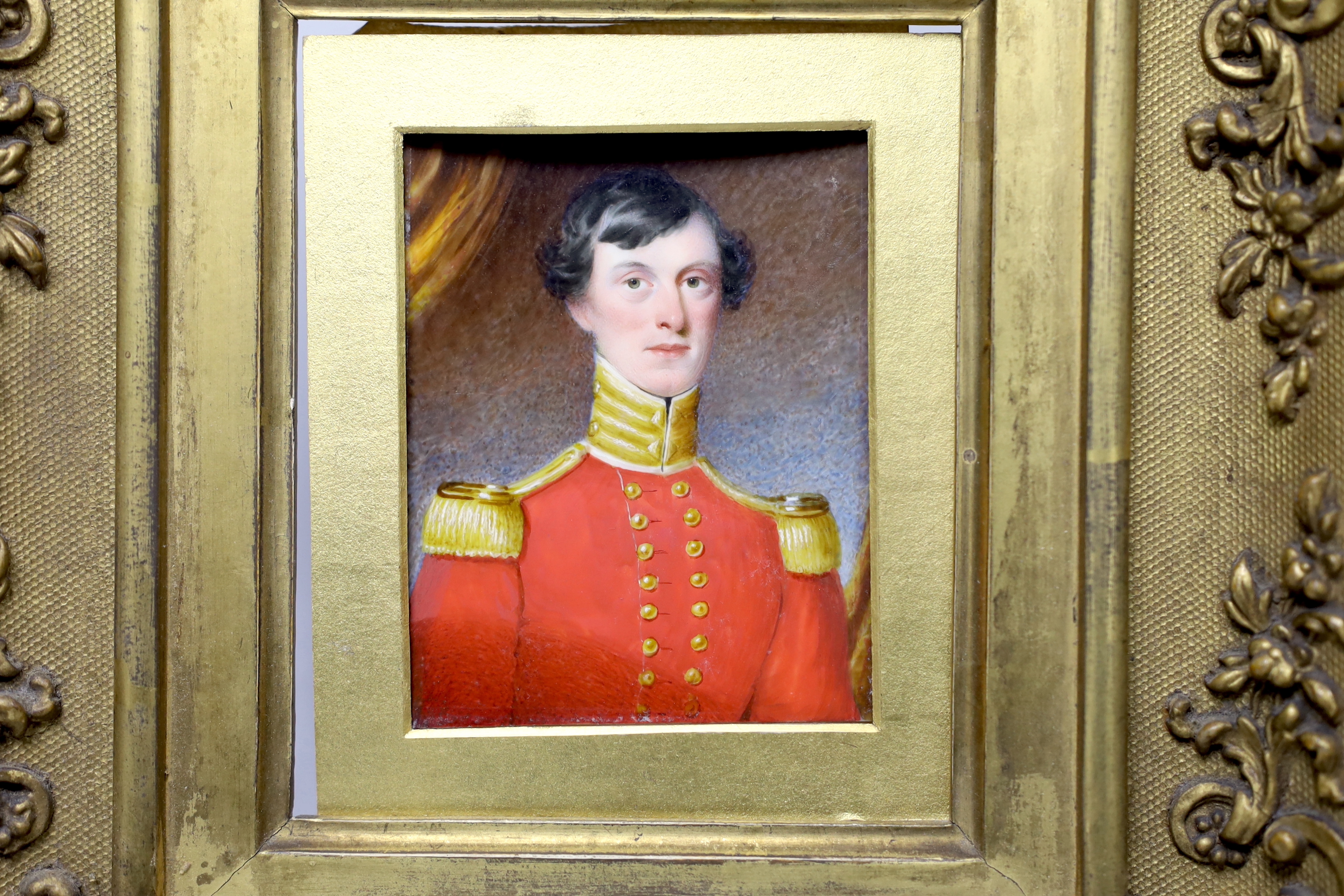 Early 19th century English school, watercolour portrait miniature on ivory of a gentleman wearing military dress, ornate gilt frame, 8.5 x 6.5cm CITES Submission reference: SKYZGXDW